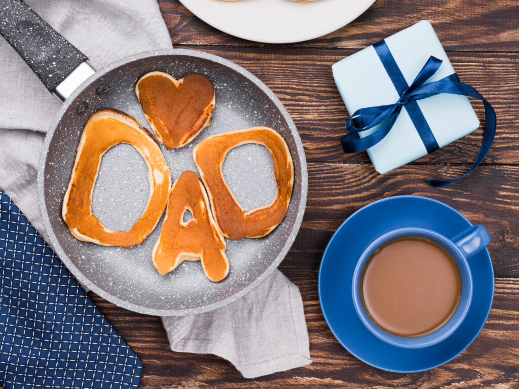 Father's Day breakfast plate with pancakes shaped to spell "DAD"