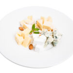 dairy commodity update from dining alliance week of march 25 2025 - cheese assortment white plate