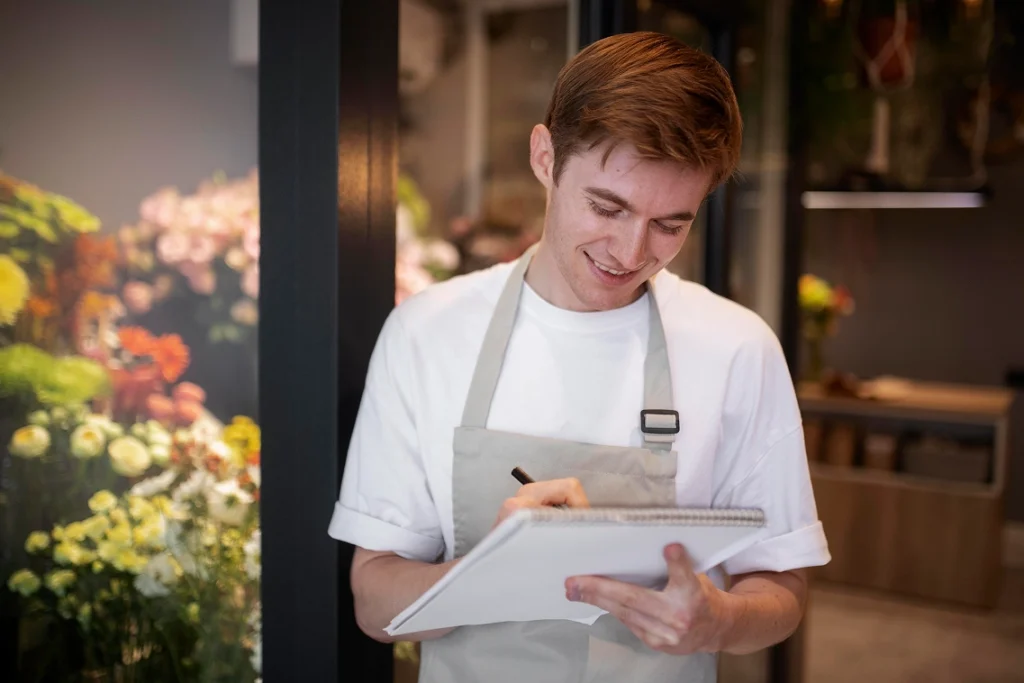 Restaurant employee reviewing inventory for wholesale food buying and purchasing strategy.
